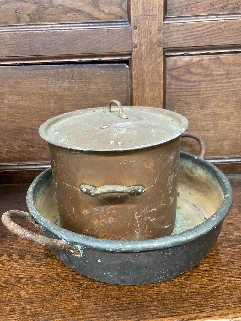 Two Victorian copper pans and a preserve pan, largest 59cm wide